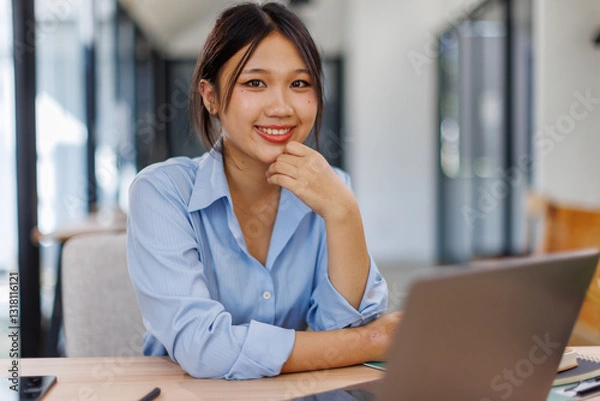 Fototapeta Asian Business woman using calculator and laptop for doing math finance on an office desk, tax, report, accounting, statistics, and analytical research concept
