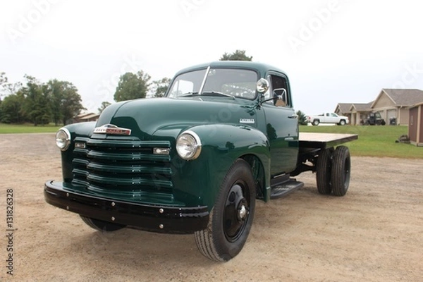 Fototapeta old red farm truck and green farm truck