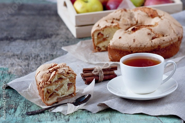 Fototapeta Apple pie with a cup of tea on wooden background. Apple Pie Apples Cup of tea Piece of cake Wooden background Delicious dessert
