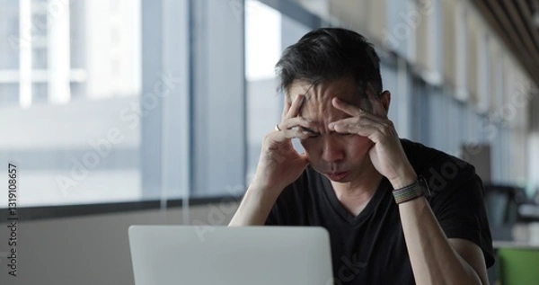 Fototapeta Asian businessman burn out on failed job in office. Elderly office worker expresses emotions Failed to work No success. Financial Communication Business problem. Working too hard overtime