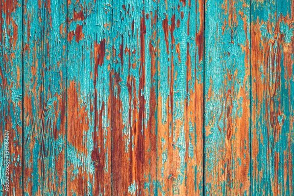 Fototapeta A close-up of aged wooden planks with peeling turquoise paint, revealing the warm brown wood beneath. The detailed texture and vibrant contrast create a rustic, weathered aesthetic