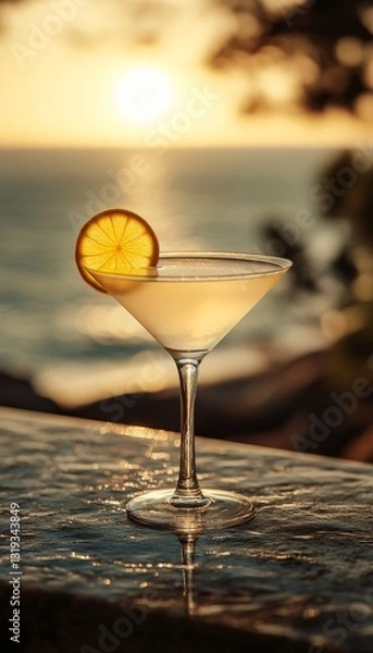 Fototapeta lemon drop cocktail in a glass at a bar on the beach