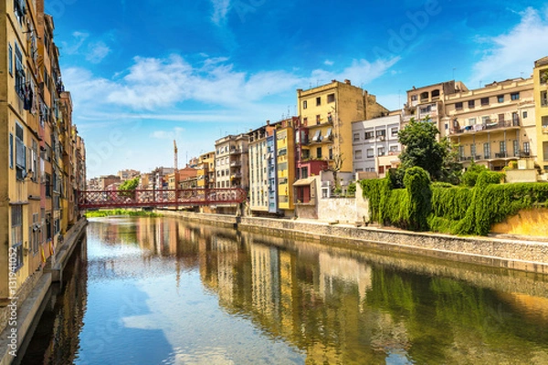 Fototapeta Colorful houses and Eiffel bridge in Girona