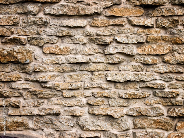 Fototapeta The surface of the stone wall background