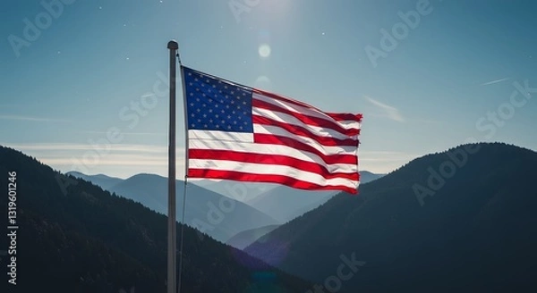 Fototapeta A Majestic Shot of the American Flag Waving Proudly Against a Mountain Backdrop