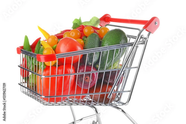 Fototapeta Fresh vegetables in shopping cart on white background