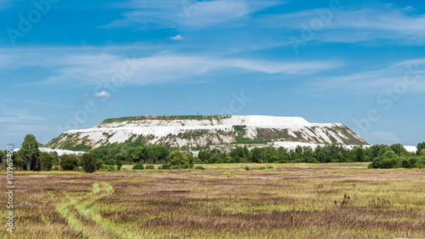 Fototapeta Panorama of artificial mountains of waste limestone