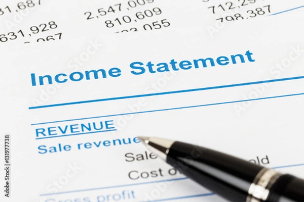 Fototapeta Income Statement in financial report book and pen, document is m