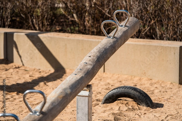 Obraz Wooden Seesaw in a Playground – Balance, Fun, and Nostalgia in Outdoor Play