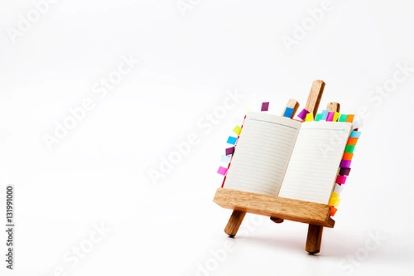 Fototapeta Note book on a reading desk isolate 