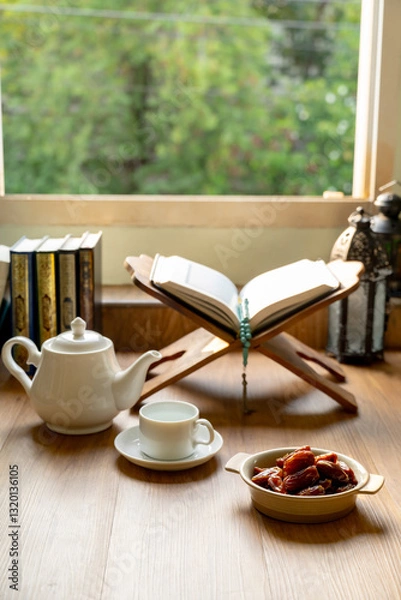 Obraz Ramadan Kareem concept, Many Date Palms are on the wooden plate and a cup of water on the wooden tables, to wait for the time of Iftar, with the concept of fruits from Muslims around the world.