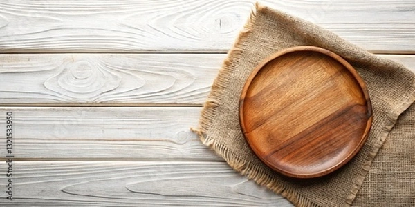 Obraz Empty Round Wooden Plate on Burlap, Rustic Table Top View
