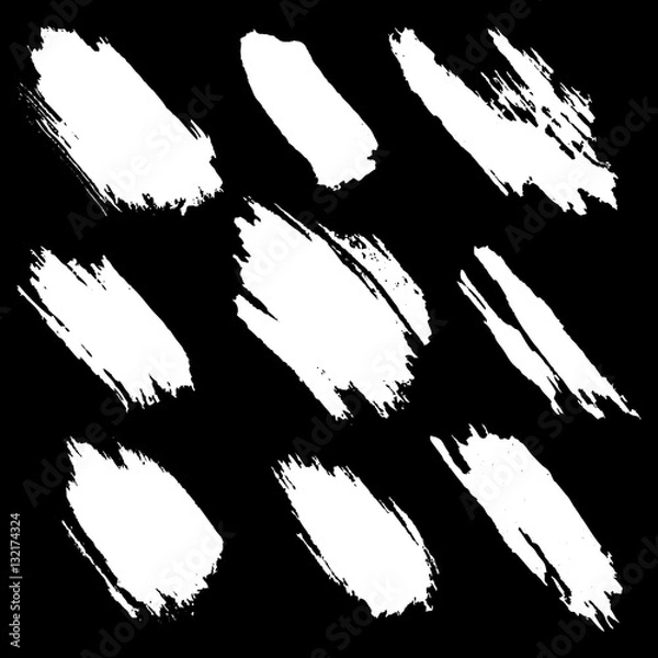 Fototapeta Vector set of white inc splash, blots, smudge and brush strokes, isolated on the black background. Grunge elements for design.