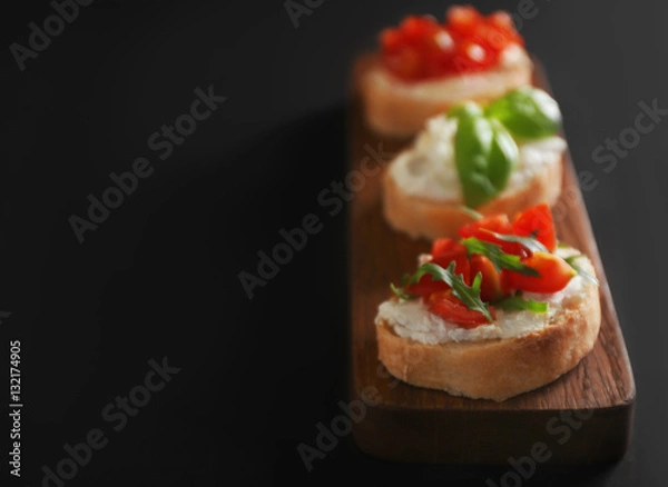 Obraz Tasty bruschettas on dark background, closeup