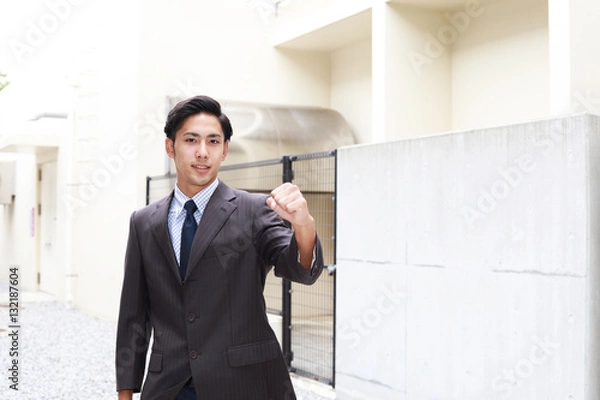 Fototapeta ガッツポーズのビジネスマン