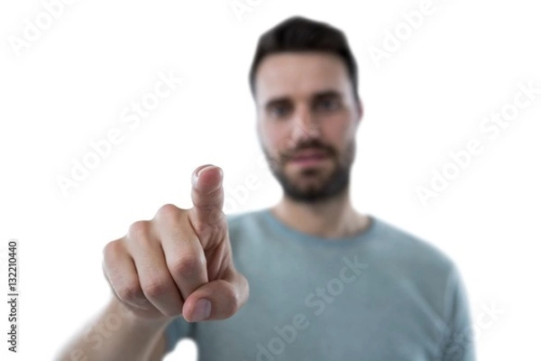 Fototapeta Man pretending to touch an invisible screen