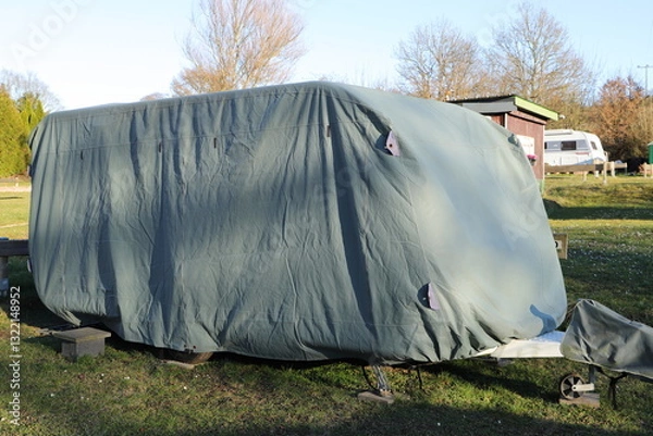 Obraz a caravan with a gray tarpaulin