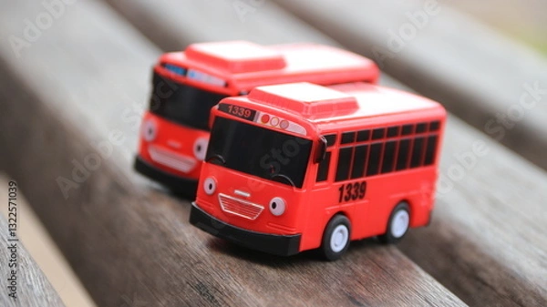 Fototapeta Red children's toy bus on a white background. stock photos