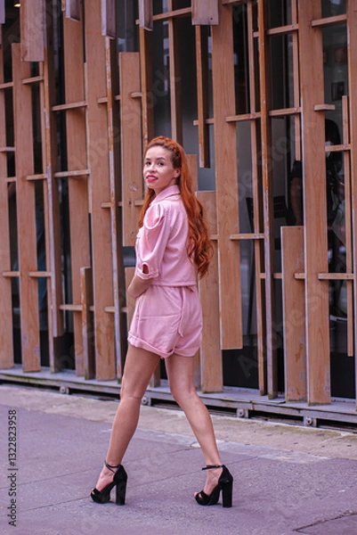 Fototapeta young woman walking on the street