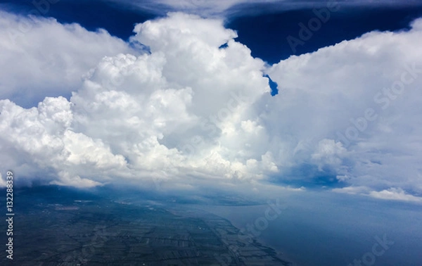 Obraz Clouds face on blue sky.