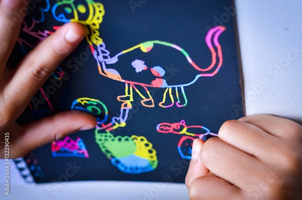 Obraz Happy boy draws  on a Scratch note colorful