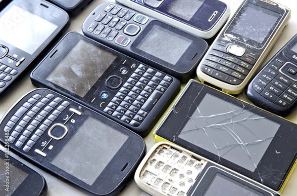 Fototapeta Old mobile phones isolated on white background