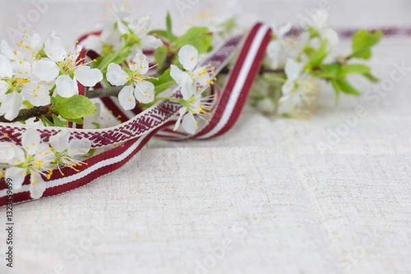 Fototapeta May 4, Independence Day of Latvia, greeting design with flowers and Latvian flag. Greeting card or banner.