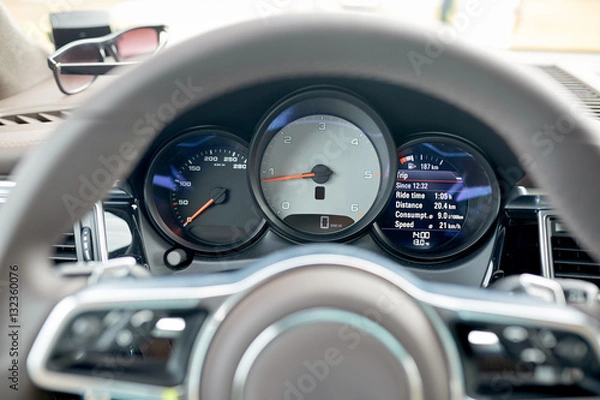 Fototapeta close up of car dashboard and steering wheel