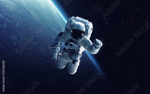 Obraz Astronaut at spacewalk. Cosmic art, science fiction wallpaper. Beauty of deep space. Billions of galaxies in the universe. Elements of this image furnished by NASA