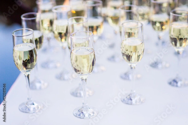 Fototapeta row of champagne glasses