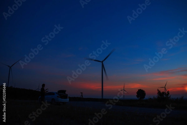 Obraz wind farm with the silhouettes.