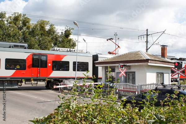 Fototapeta railway crossing in city