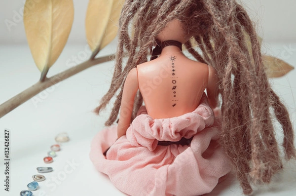 Obraz Doll with dreadlocks and tattoo with solar system