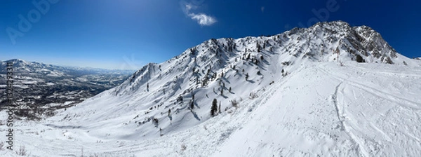 Fototapeta Panoramic view of the snowy mountains at Snowbasin ski resort.