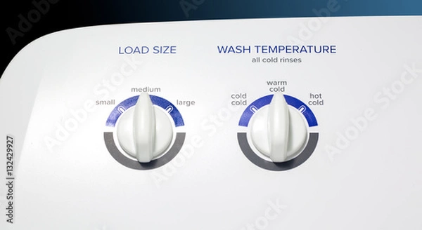 Fototapeta Washing Machine-Load-Temp Knobs - Clothes washer front panel with a focus on the Load Size and Temperature knobs. Straight lighting.