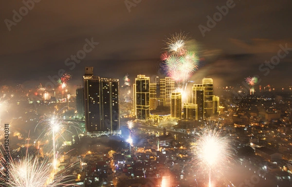 Obraz Fireworks and Manila city skyline