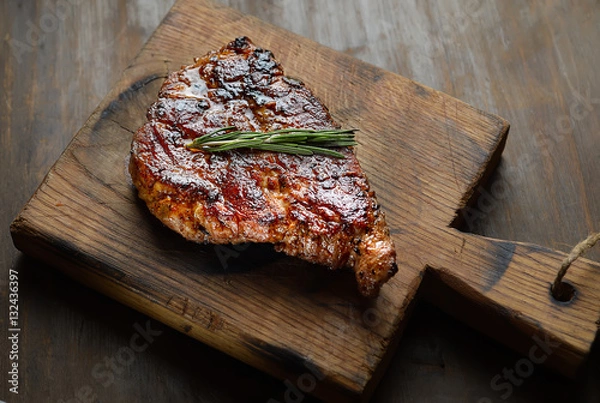 Fototapeta grilled juicy steak with rosemary. 