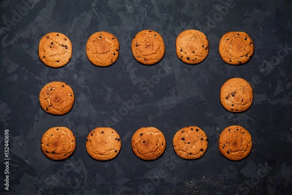 Fototapeta Oatmeal cookies on a black background. Top view 