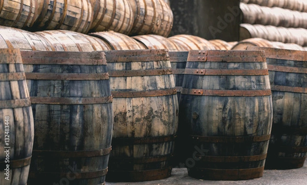 Obraz Old vintage whisky barrels filled of whiskey placed in order in
