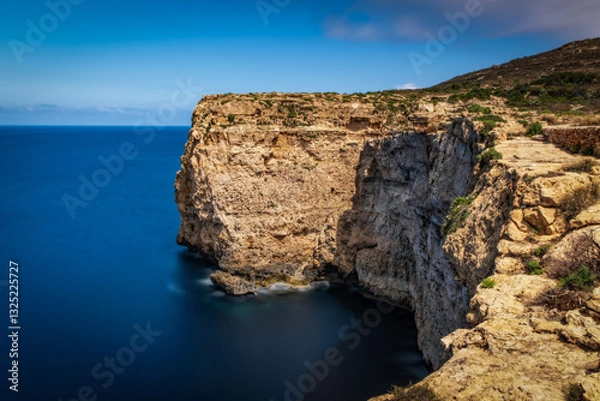 Fototapeta Dingli Cliffs, coast of Malta. Long exposure picture, june 2023