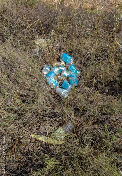Fototapeta Soda cans dumped in the gully