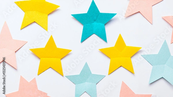Obraz colorful stars madw by color paper in various sizes and colors arranged against a white background
