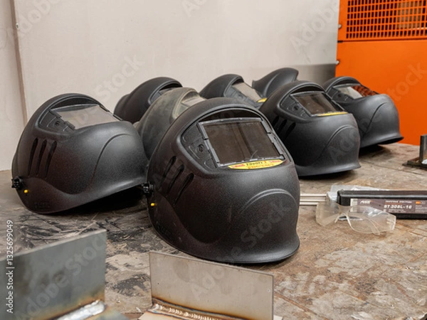 Obraz Metalworking: a welding mask on a workbench.