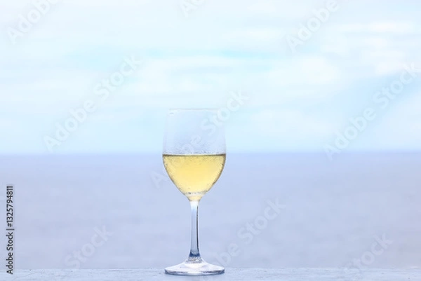Fototapeta a glass of white wine on the background of the sea relaxing by the sea with wine
