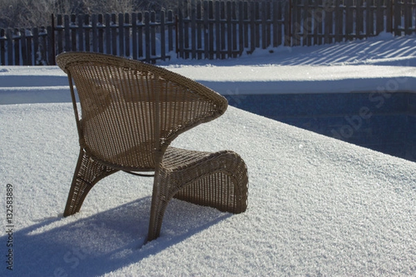 Fototapeta Ice swimming pool in the winter, Steps, hand-rails and garden chair in the frozen blue pool ice-hole