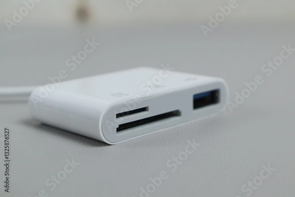 Fototapeta Kudus, 13 Maret 2025 - SD Card Camera Reader Adapter,Flashdisk to Apple iphone . isolated on white background.