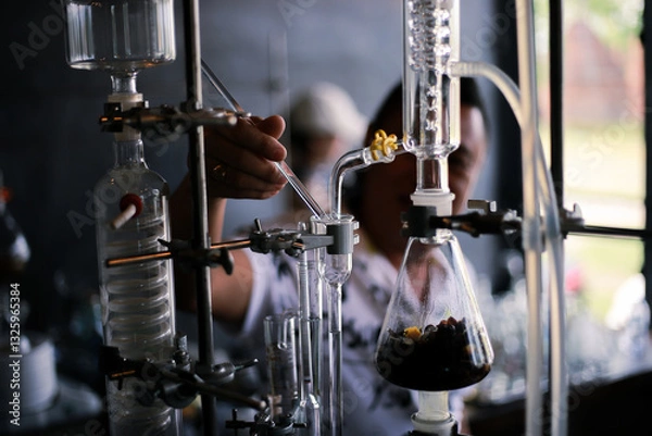 Fototapeta selective focus Glassware in the laboratory extracts the scent from herbs to get the aroma. Soxhlet Extractor. heating element.Organic chemistry class.Pharmacy Extraction
