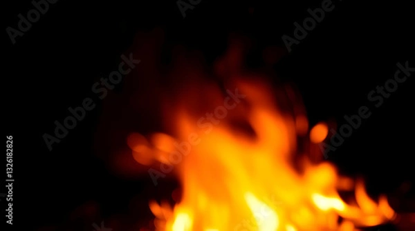 Obraz Blurred flames against a dark background, creating a warm, intense, and abstract fire effect.