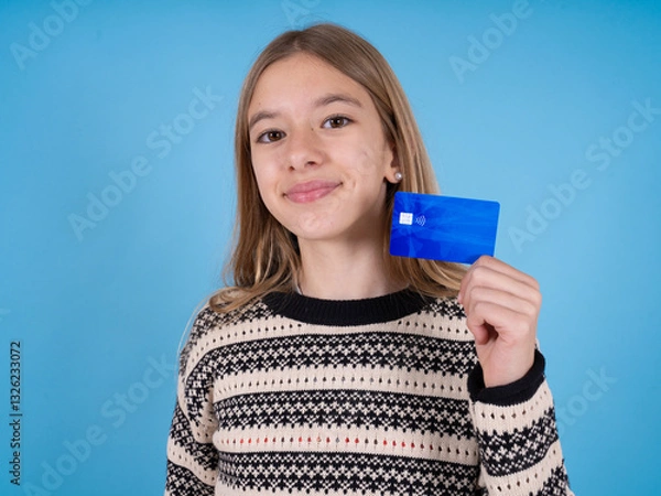 Fototapeta Close up photo of optimistic beautiful caucasian girl wearing striped sweater hold card