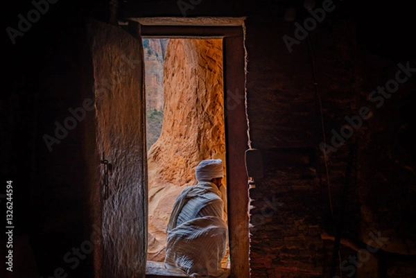 Fototapeta Priest on the doorstep of Abune Yemata rock-hewn church in Tigray, Ethiopia